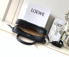 Black Loewe-branded zip bag with top zipper and crossbody strap