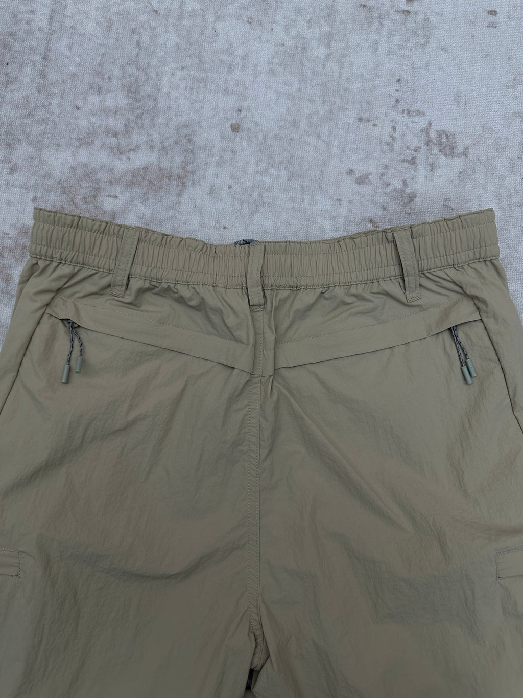 Light olive pants with elastic waistband and front drawcord