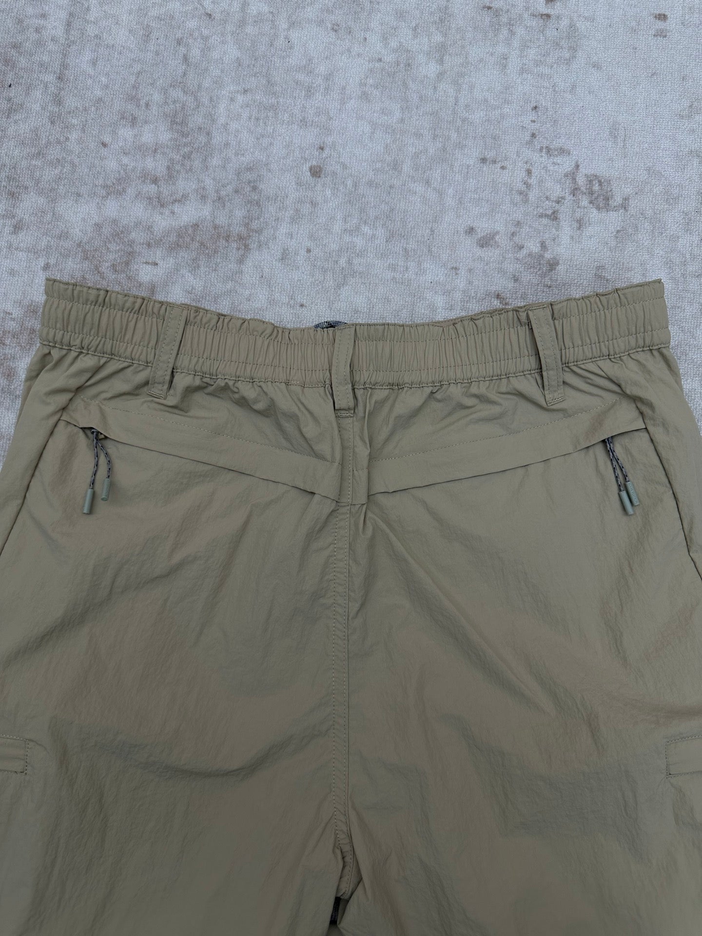Light olive pants with elastic waistband and front drawcord