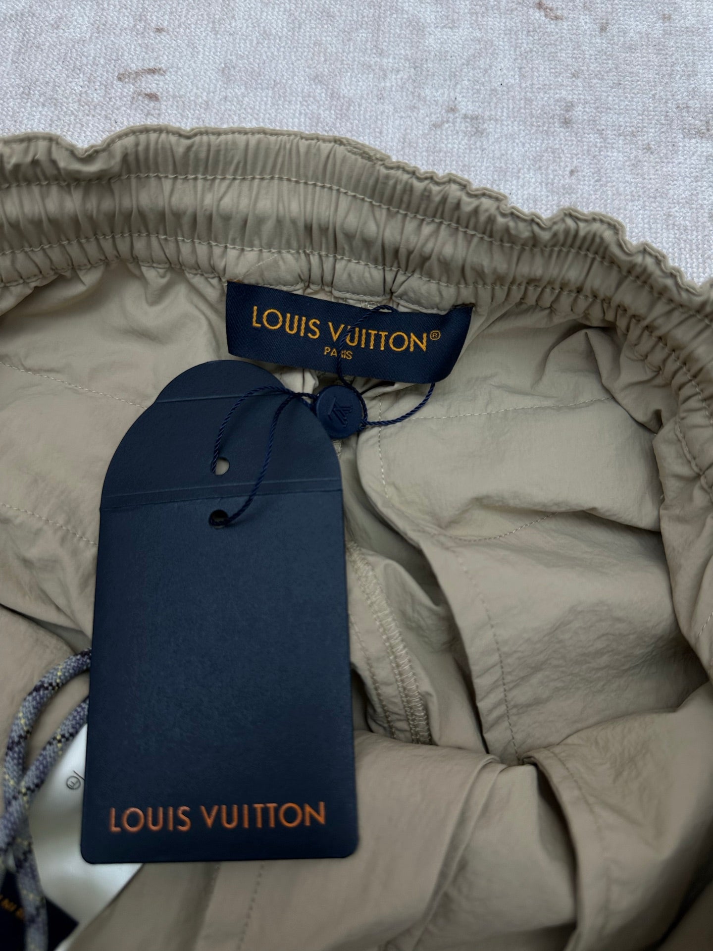 Louis Vuitton interior waistband of light olive drawstring pants