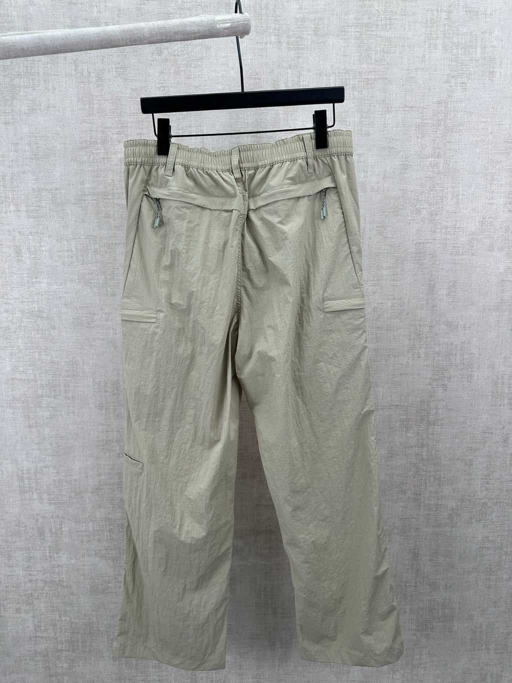 Light olive cargo pants with elastic waistband and side pockets