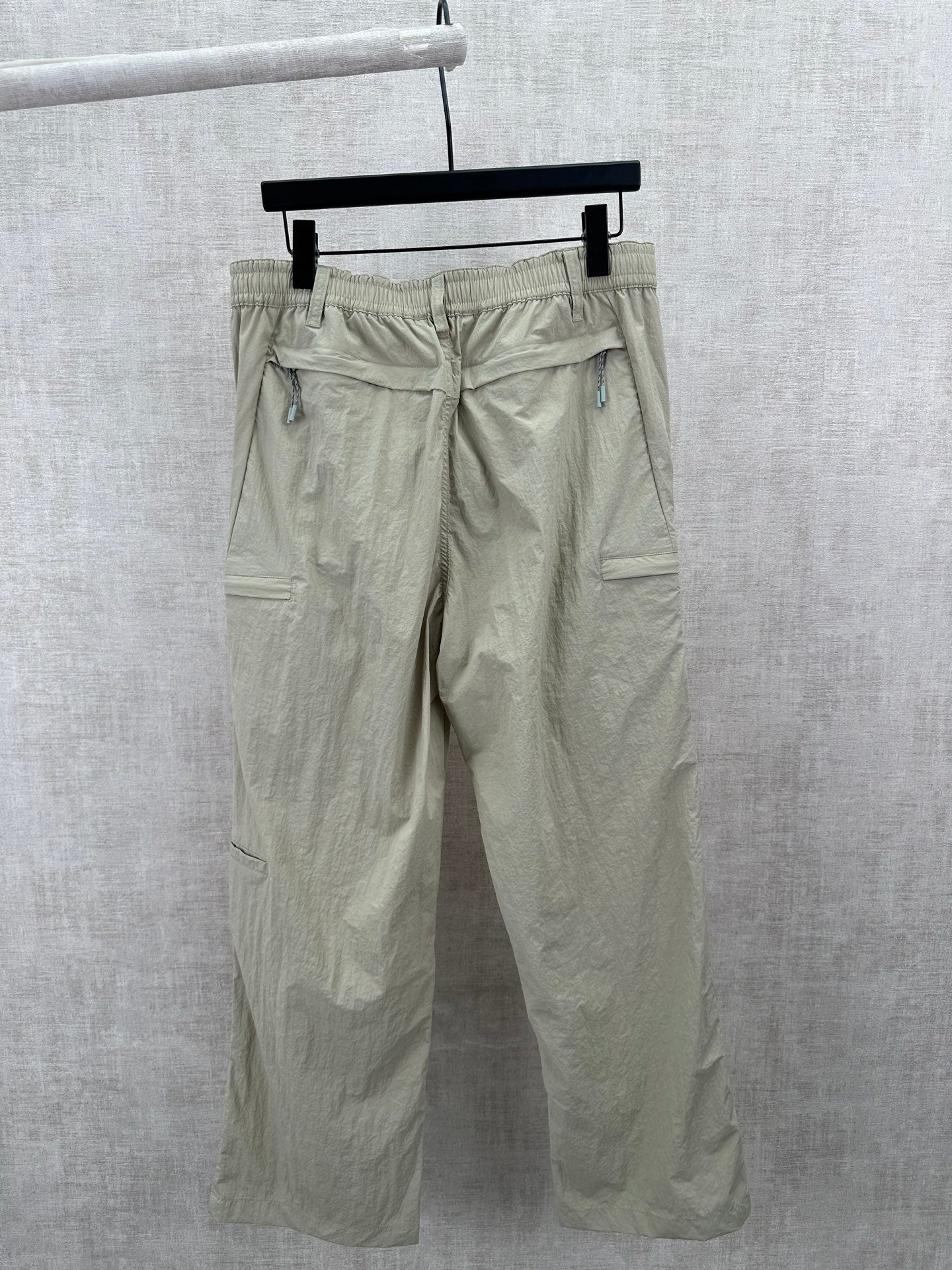 Light olive cargo pants with elastic waistband and side pockets