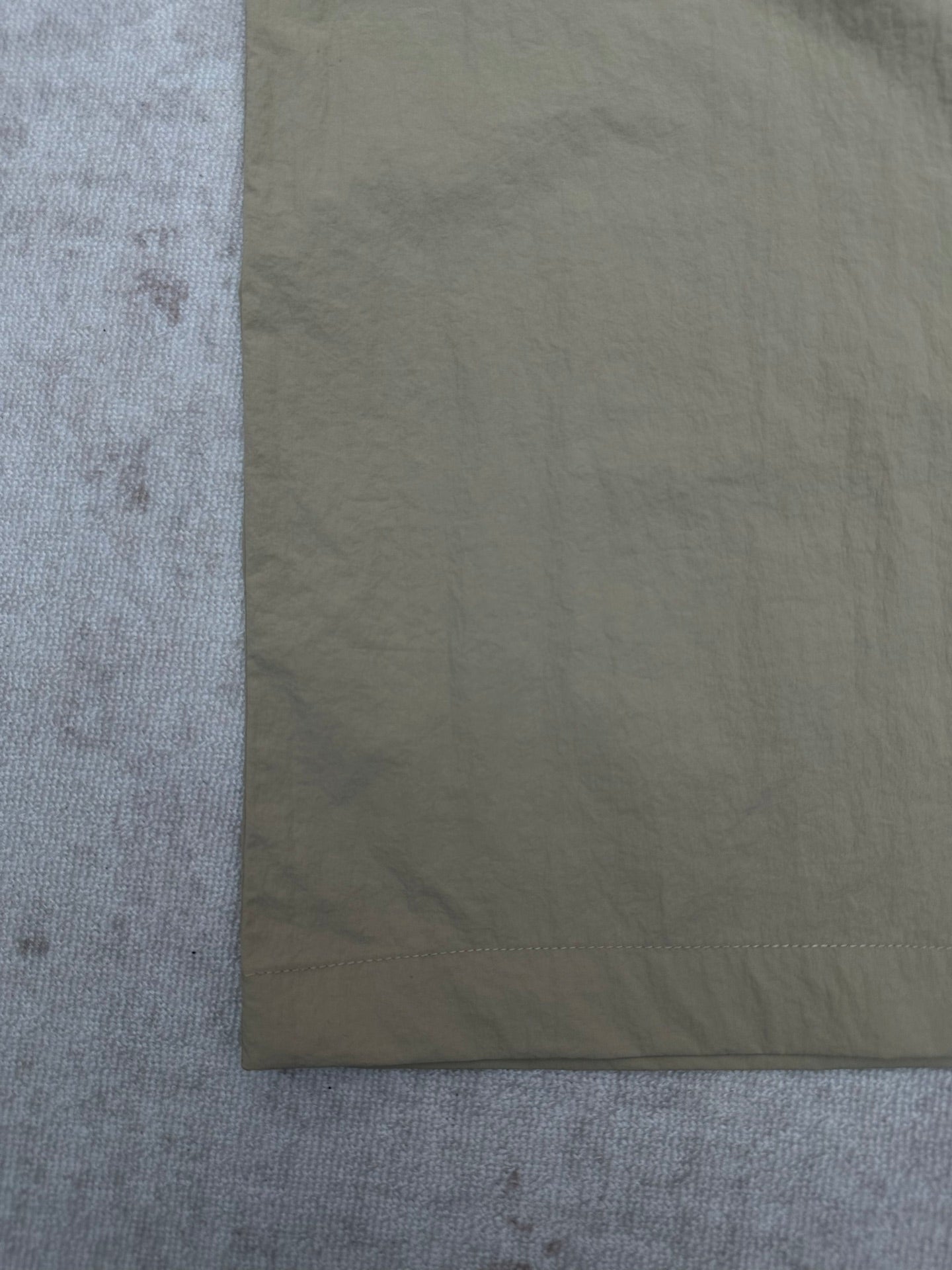Light olive pants leg with straight hem