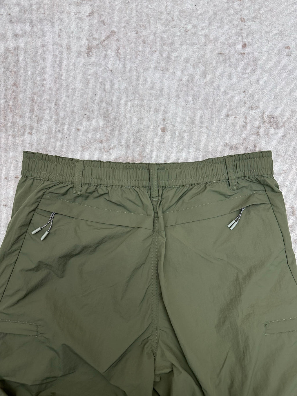Olive green Louis Vuitton pants waistband with elastic back and rear welt pockets