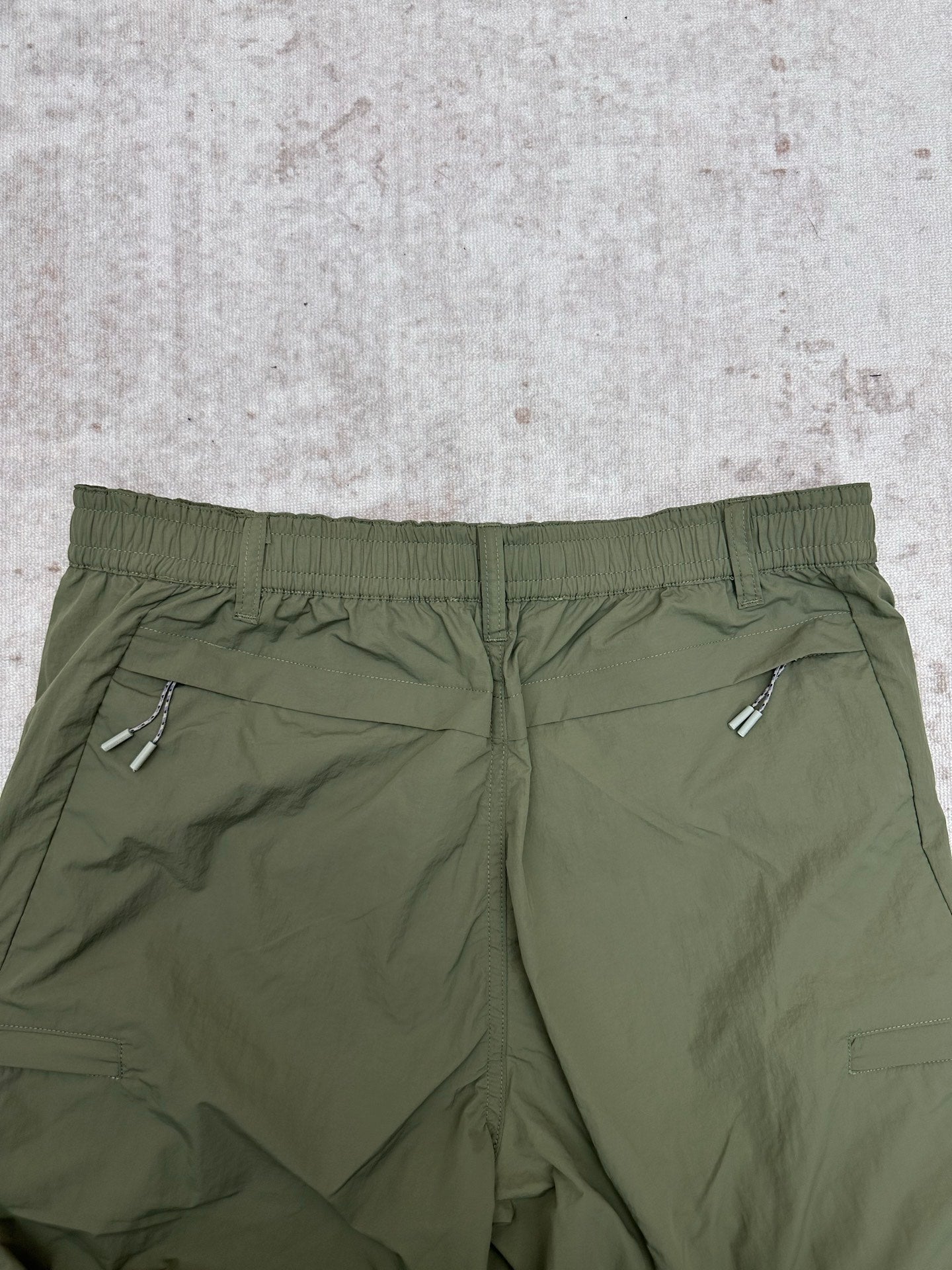 Olive green Louis Vuitton pants waistband with elastic back and rear welt pockets