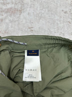 Olive green Louis Vuitton pants inside view with fabric label and drawstring cord