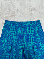 Blue shorts with teal circular pattern and front seam detail