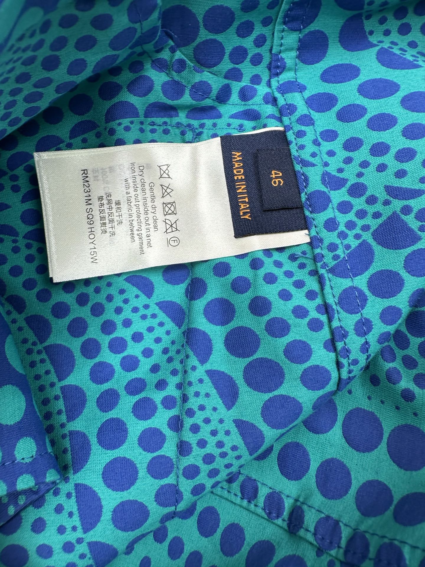 Louis Vuitton size label on blue long-sleeve button-up shirt with teal dot pattern