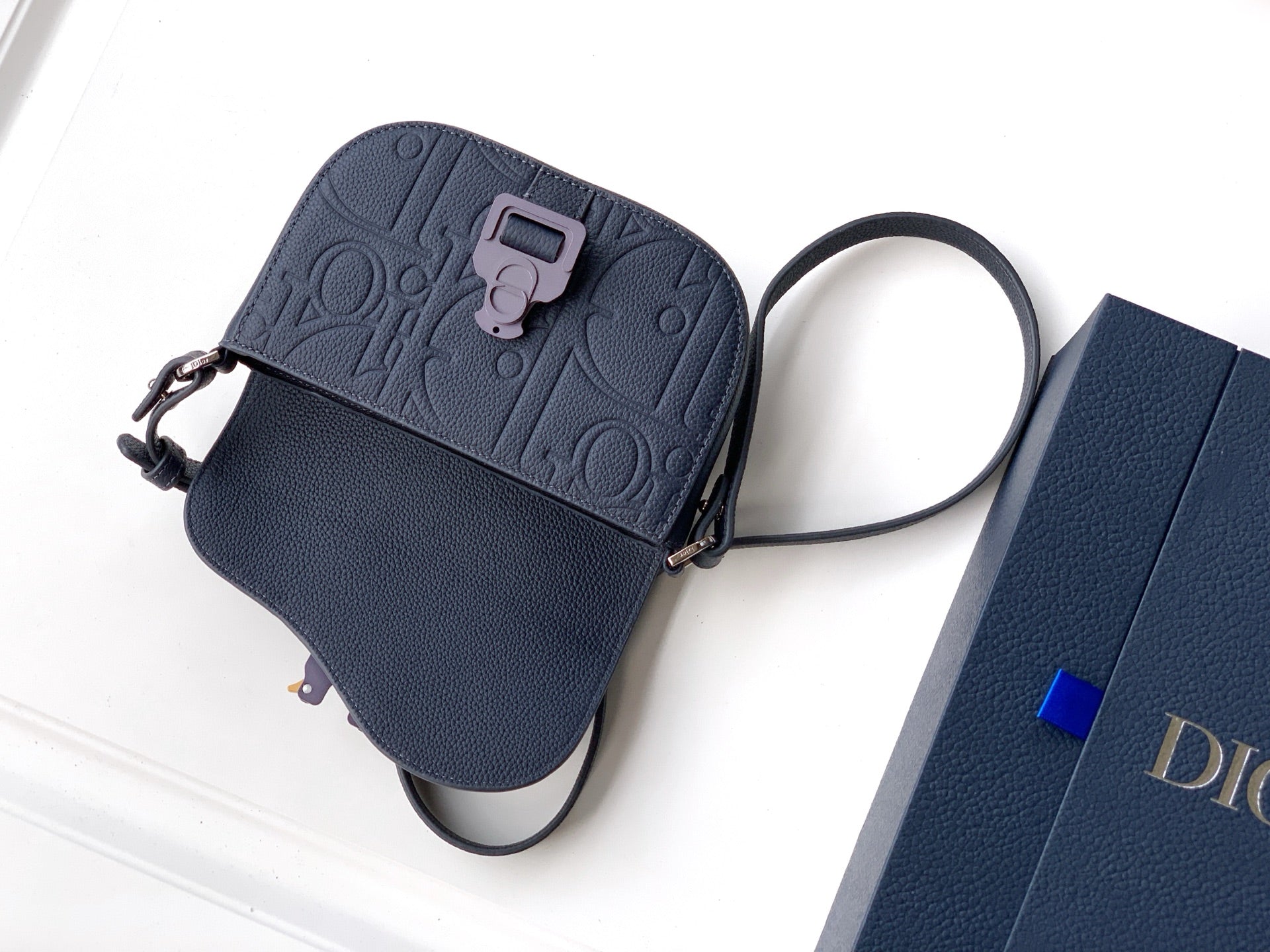 Navy blue Dior crossbody bag with detachable straps and front flap