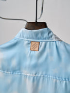 Light blue short-sleeve button-up shirt, back yoke with sewn Louis Vuitton patch