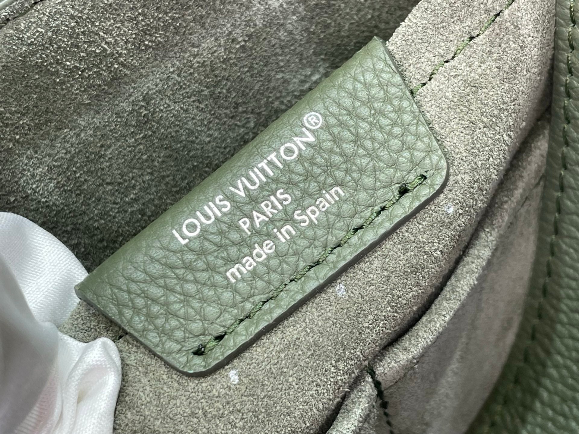Louis Vuitton Paris made in Spain leather label patch on gray bag