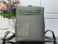 Louis Vuitton leather backpack with front flap and magnetic clasp, sage green.