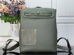 Louis Vuitton leather backpack with front flap and magnetic clasp, sage green.