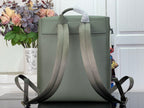 Louis Vuitton leather backpack back view with top handle and adjustable straps, sage green.