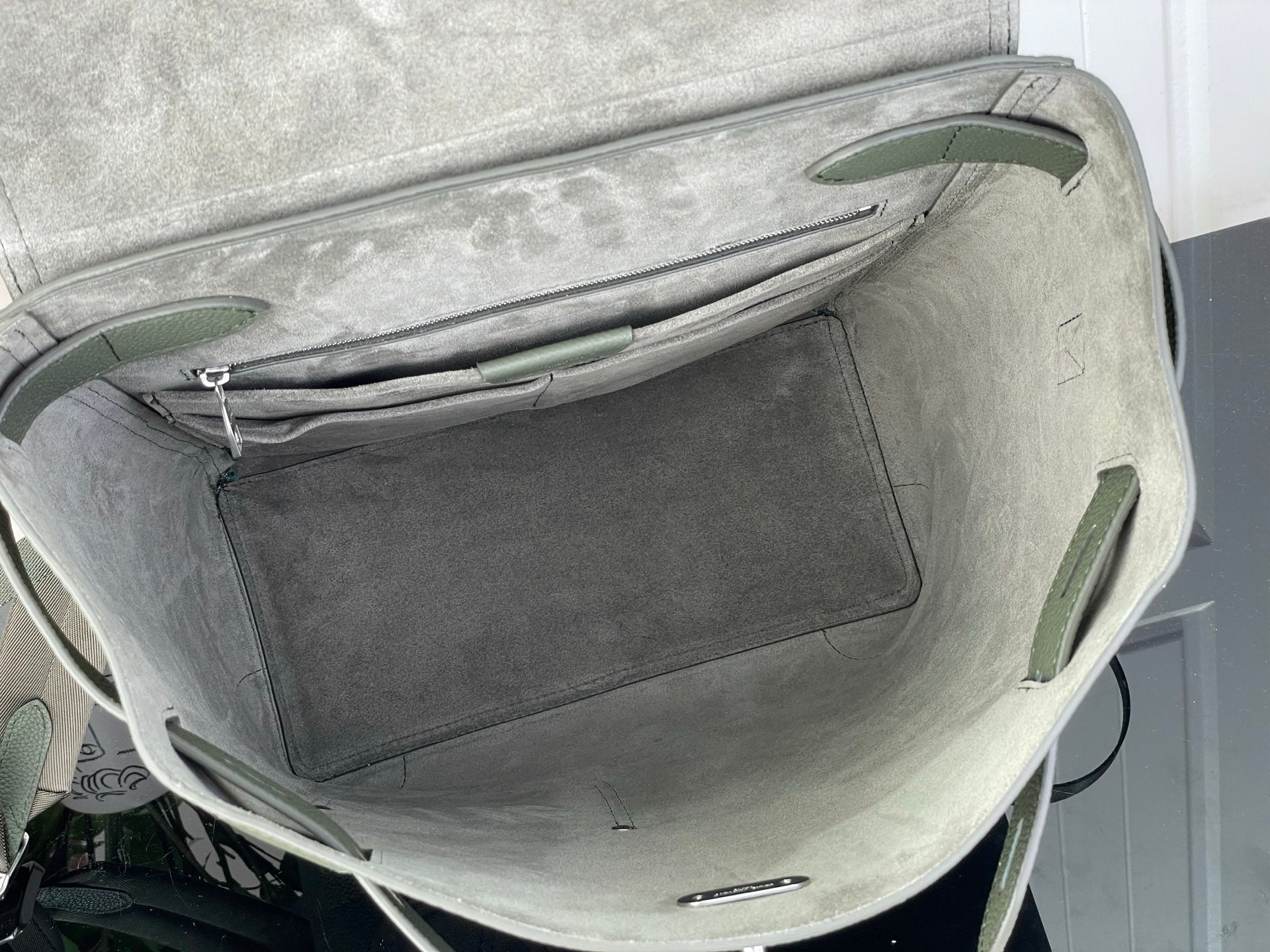 Louis Vuitton shoulder bag in light gray with front zip pocket and top handle