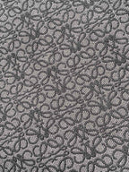 Jacquard fabric pattern for a Loewe tote bag in dark charcoal tones