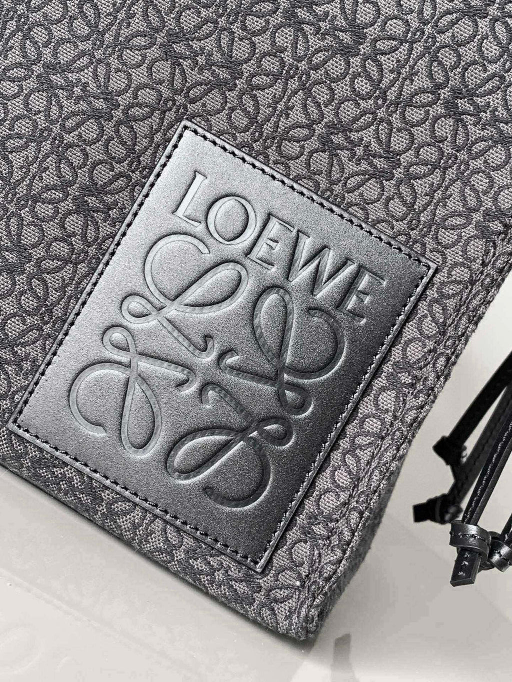 Loewe logo patch on jacquard tote bag, textured leather patch and stitched edge