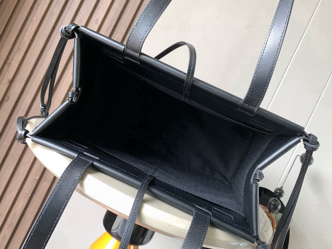 Loewe tote bag open top with black leather interior lining and long shoulder straps