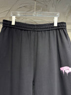 Black wide-leg pants with gathered elastic waistband