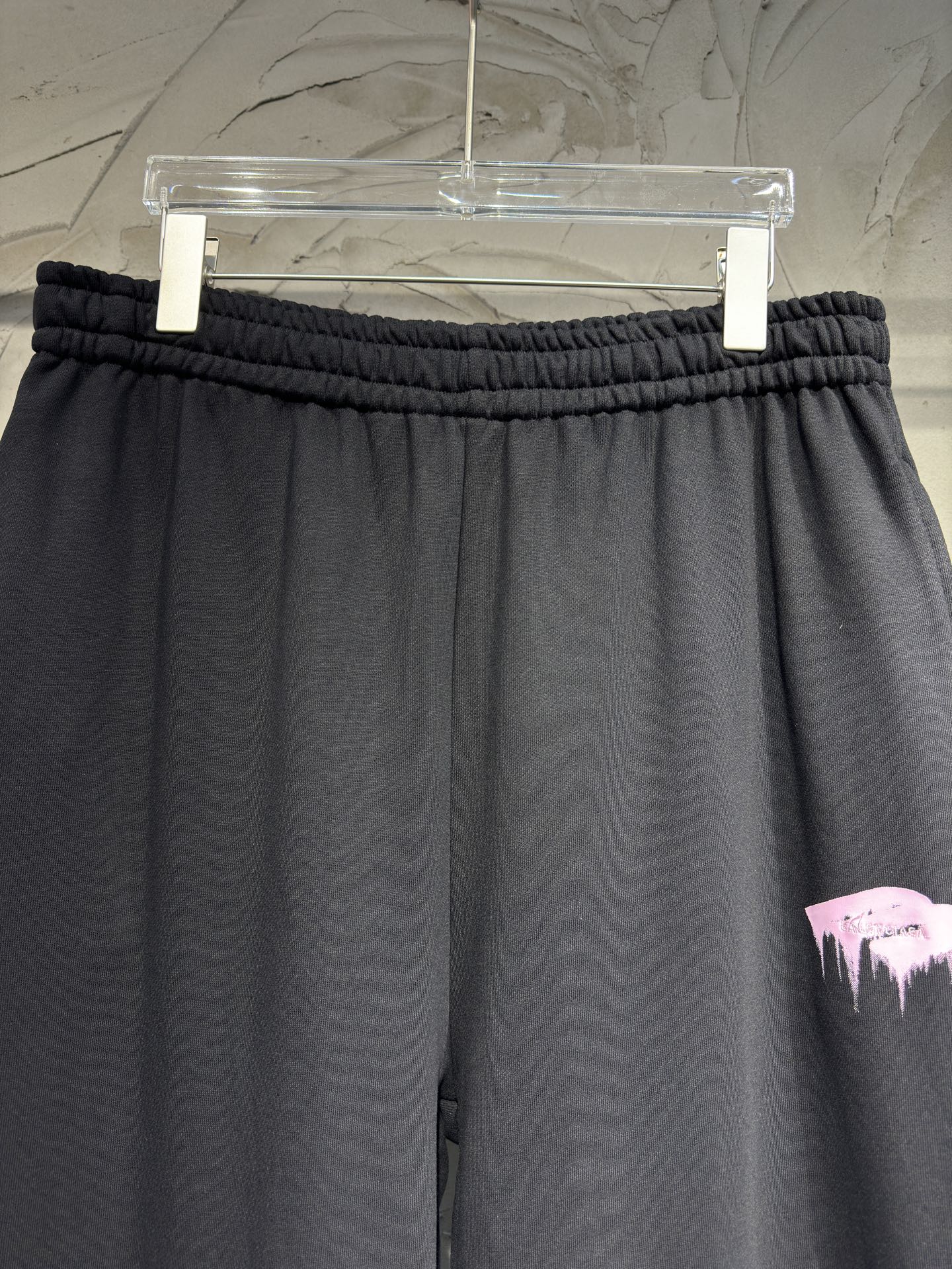Black wide-leg pants with gathered elastic waistband