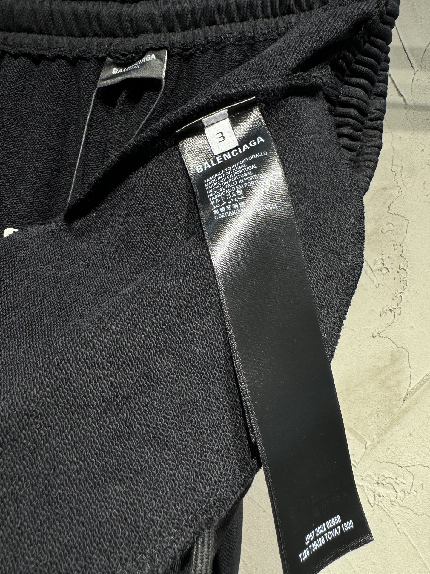 Black Balenciaga track pants with elastic waistband and inner size tag