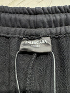 Black pants with BALENCIAGA UNISEX label at elastic waistband