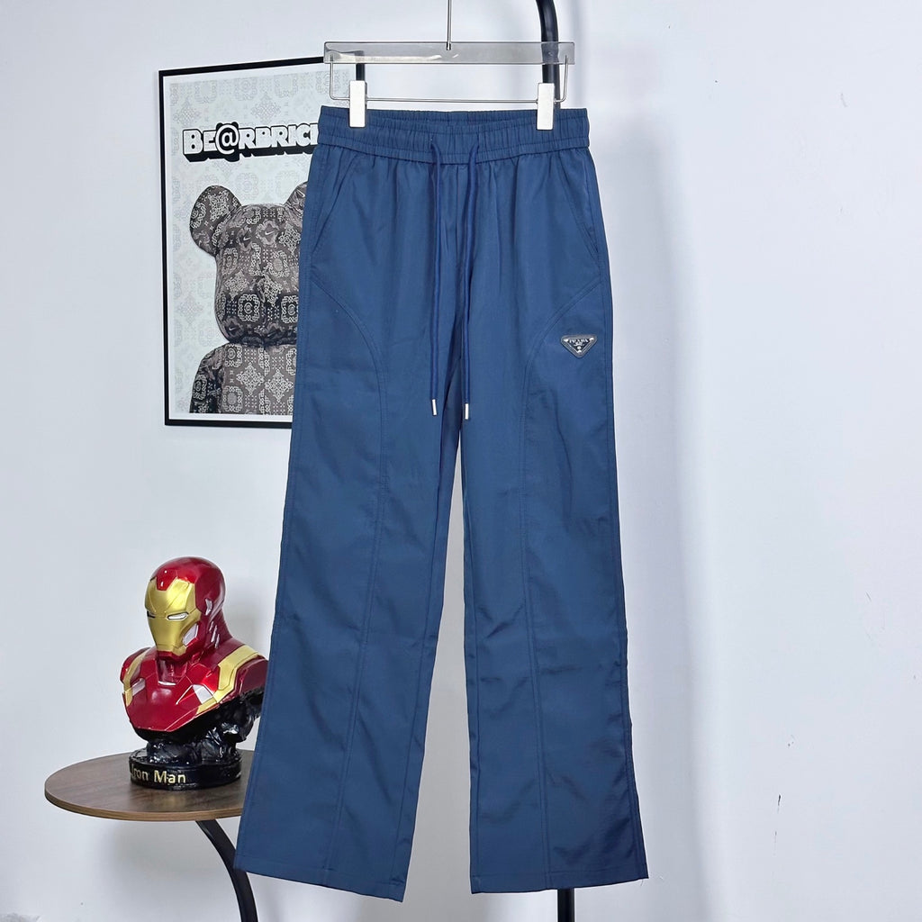 Prada pants in dark blue with elastic waist, drawstring, and side pockets