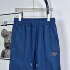 Prada pants in dark blue with elastic waistband and drawstring; side seam details