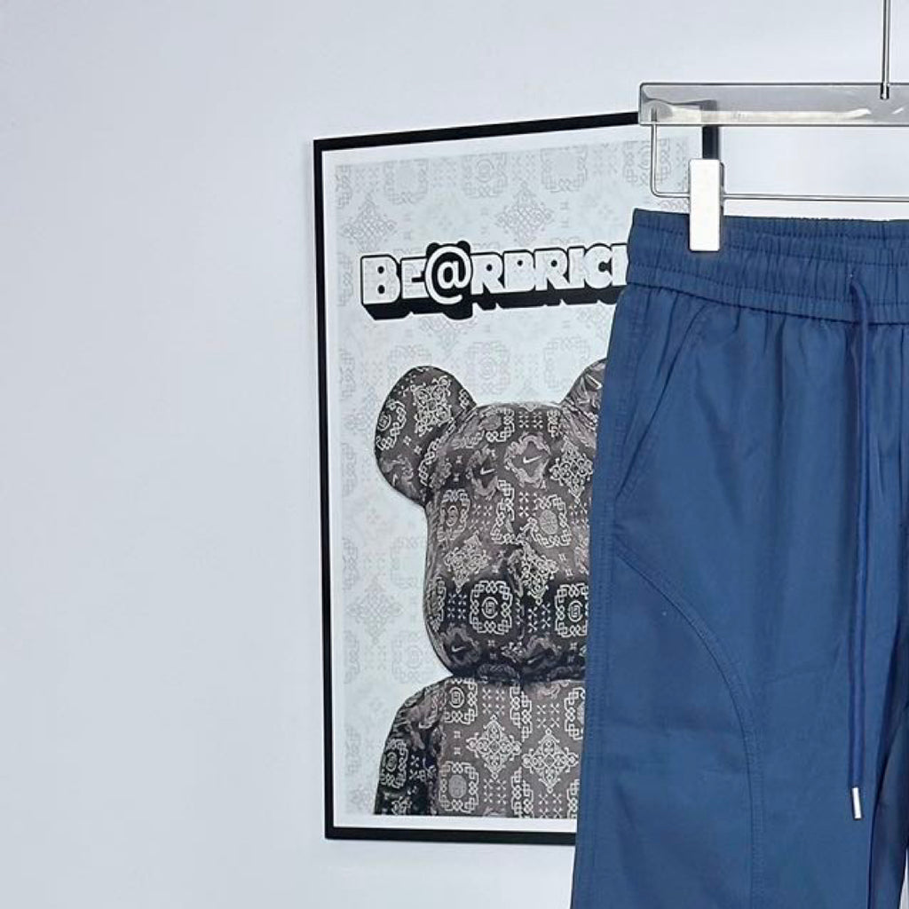 Prada pants in dark blue with elastic waistband and curved side pocket seams