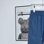 Prada pants in dark blue with elastic waistband and curved side pocket seams