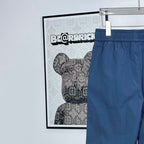 Prada pants in dark blue with elastic waistband and front drape