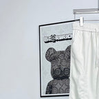 Prada white pants, elastic waistband and drawstring, back view