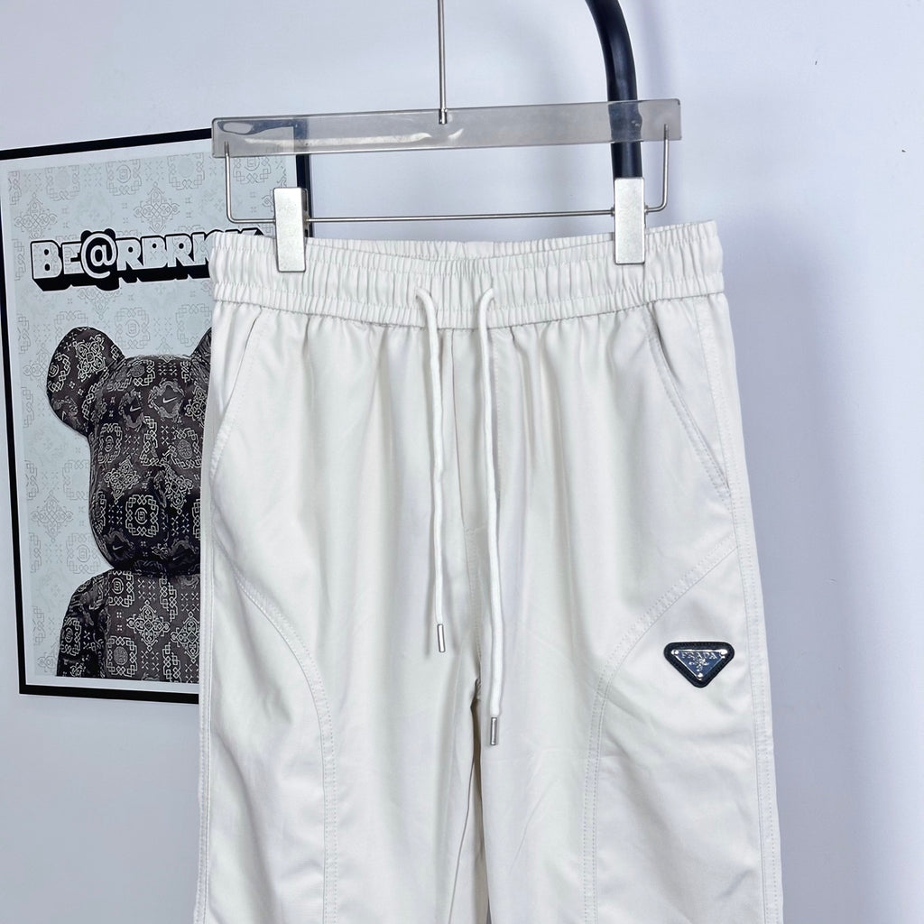Prada white pants with drawstring and triangle logo patch, elastic waist, wide leg
