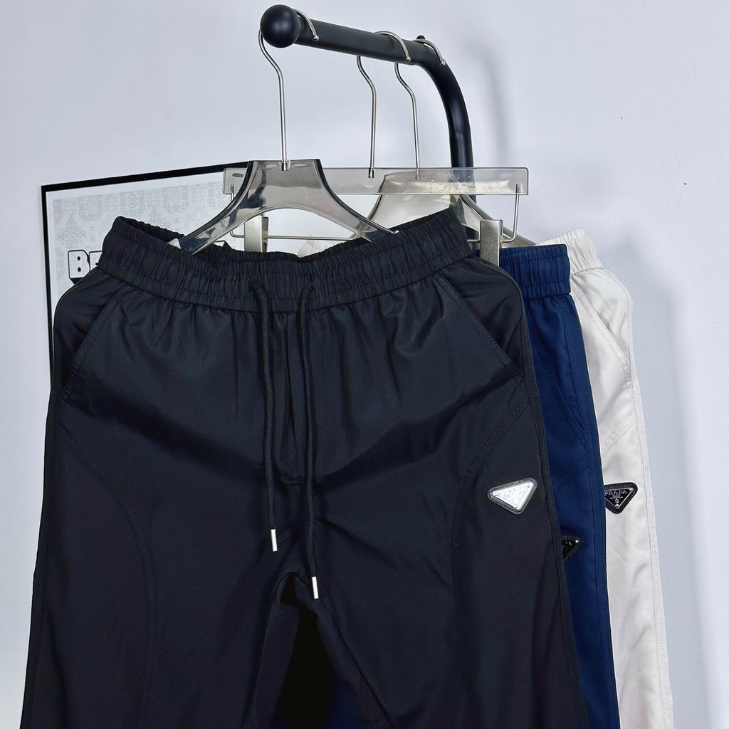 Prada pants set on hangers: dark navy and white options, elastic waist and drawstring
