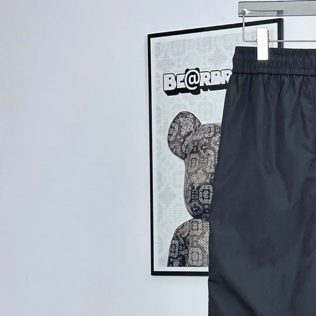 Prada pants in dark navy with elastic waistband and drawstring; leg pocket seams
