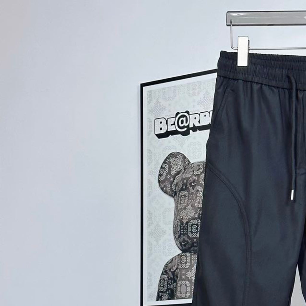 Prada pants in dark navy with elastic waistband and side pocket seam detail