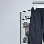 Prada pants in dark navy with elastic waistband and side pocket seam detail