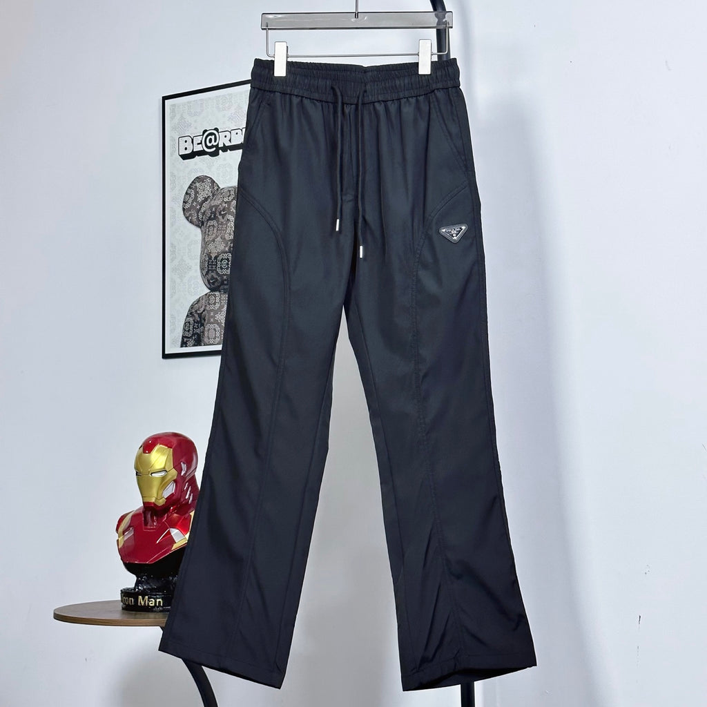 Prada pants in dark navy with elastic waist, drawstring, and wide cropped legs