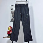 Prada pants in dark navy with elastic waist, drawstring, and wide cropped legs