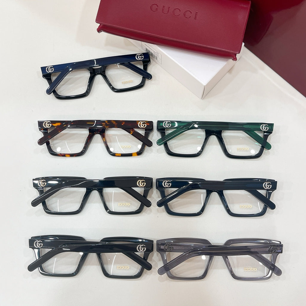 Assorted rectangular eyeglasses with clear lenses and mixed dark frame colors in one view