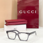 Rectangular eyeglasses with gray frame and clear lenses, tortoiseshell pattern on temples