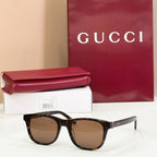Gucci sunglasses with black frame and brown gradient lenses