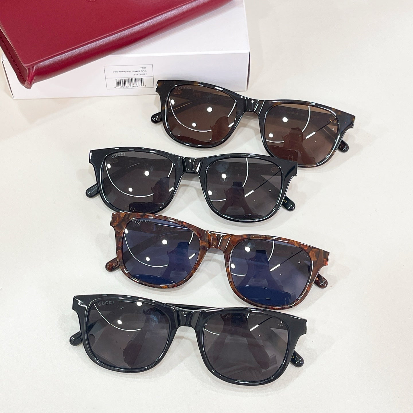 Set of four Gucci sunglasses with mixed frames and tinted lenses