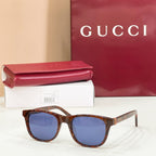 Gucci sunglasses with tortoiseshell frame and blue tinted lenses