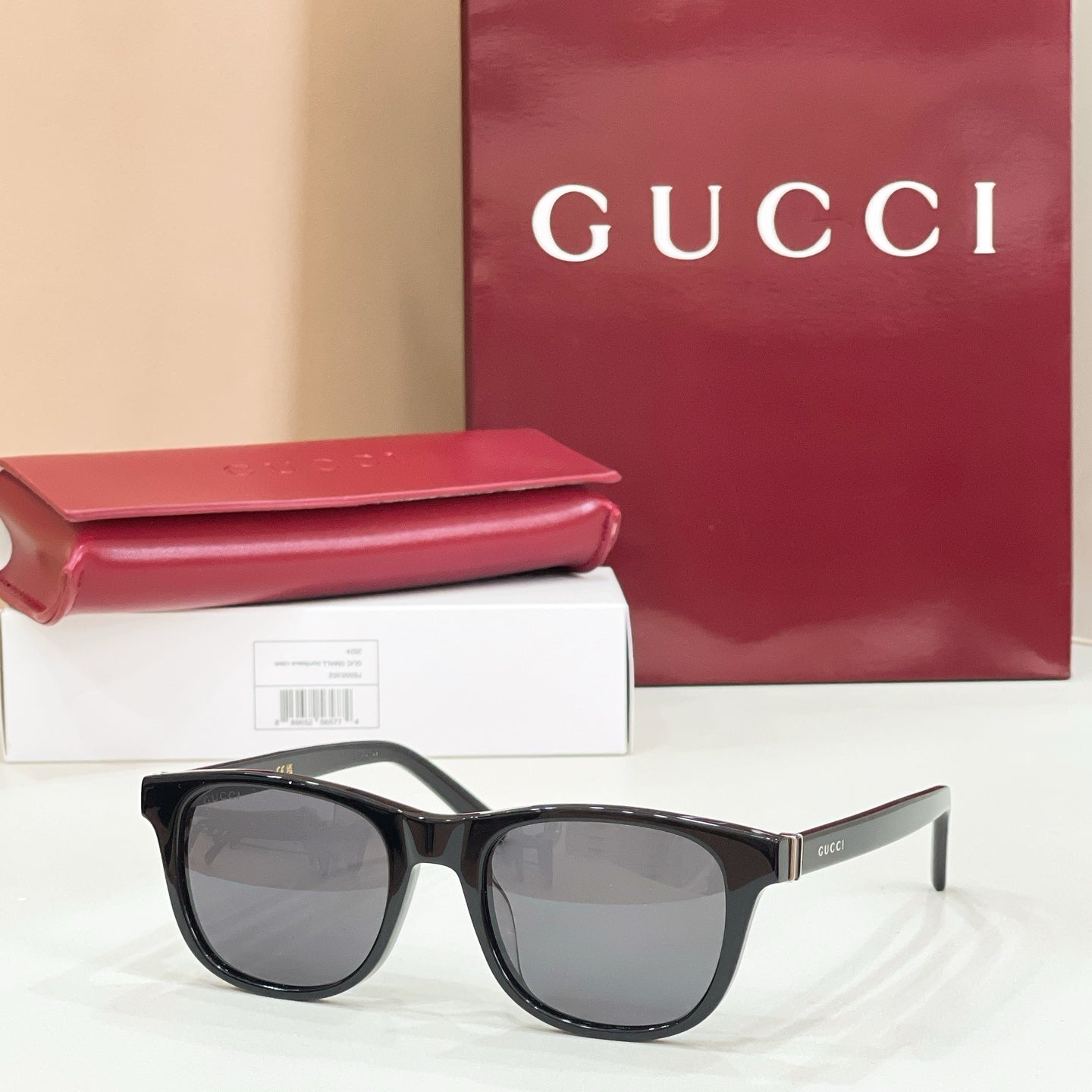 Gucci sunglasses with black frame and gray tinted lenses