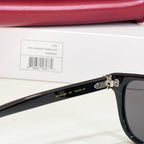 Gucci sunglasses side with black frame, metal hinge, and printed sizing