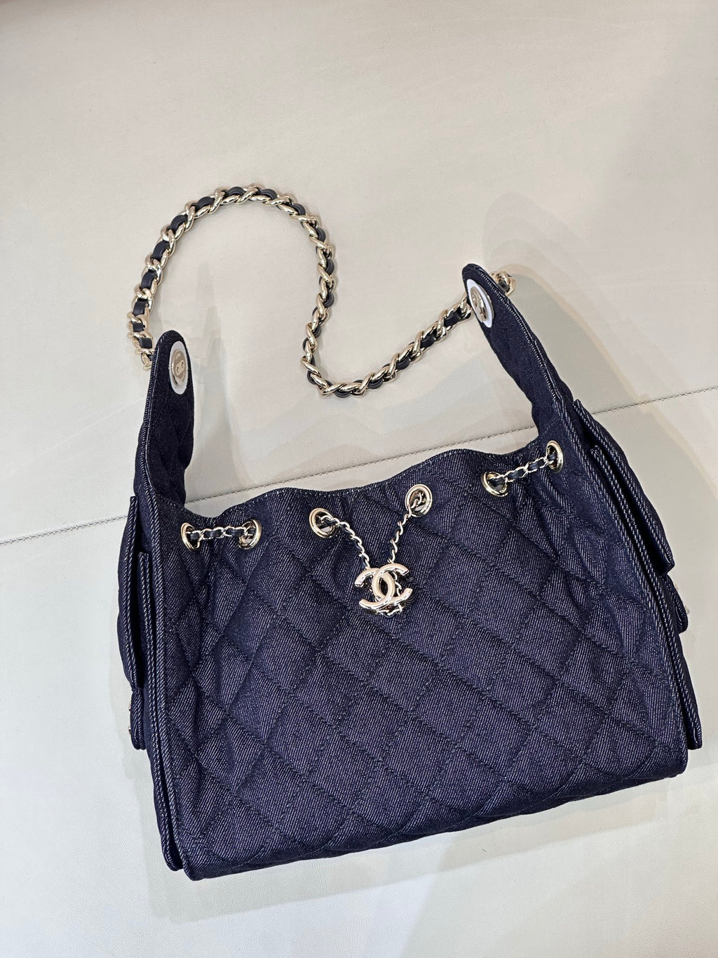 Chanel quilted dark blue shoulder bag with top chain strap and logo clasp