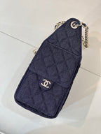 Chanel quilted dark blue clutch with chain strap and circular logo detail