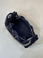 Chanel quilted dark blue bag interior with chain trim and snap closure