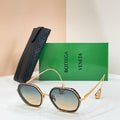 Bottega Veneta sunglasses with gold-tone frame and blue-tinted lenses
